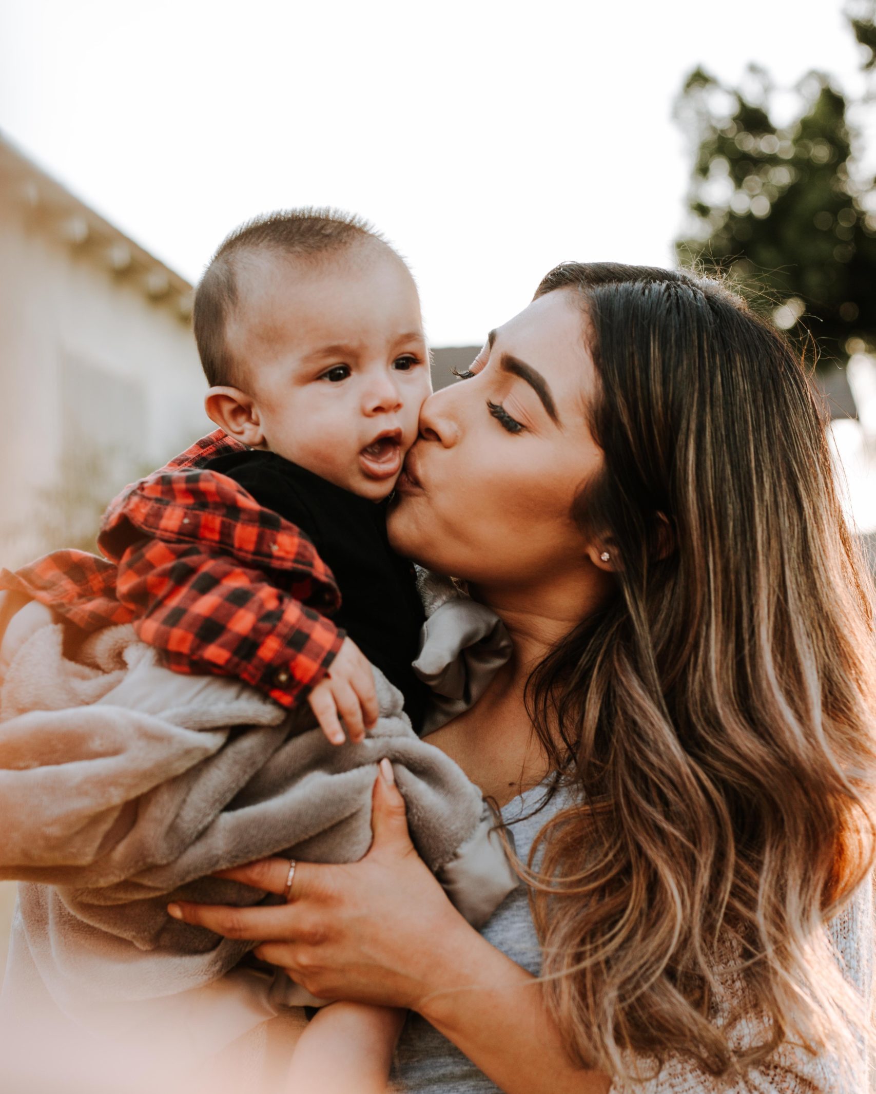 Parent Life YFC parent kissing child